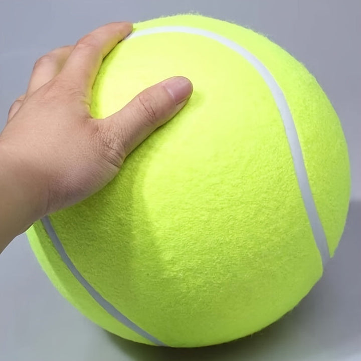 Giant non-toxic tennis ball dog toy, high visibility yellow, perfect for large dogs and active outdoor play.