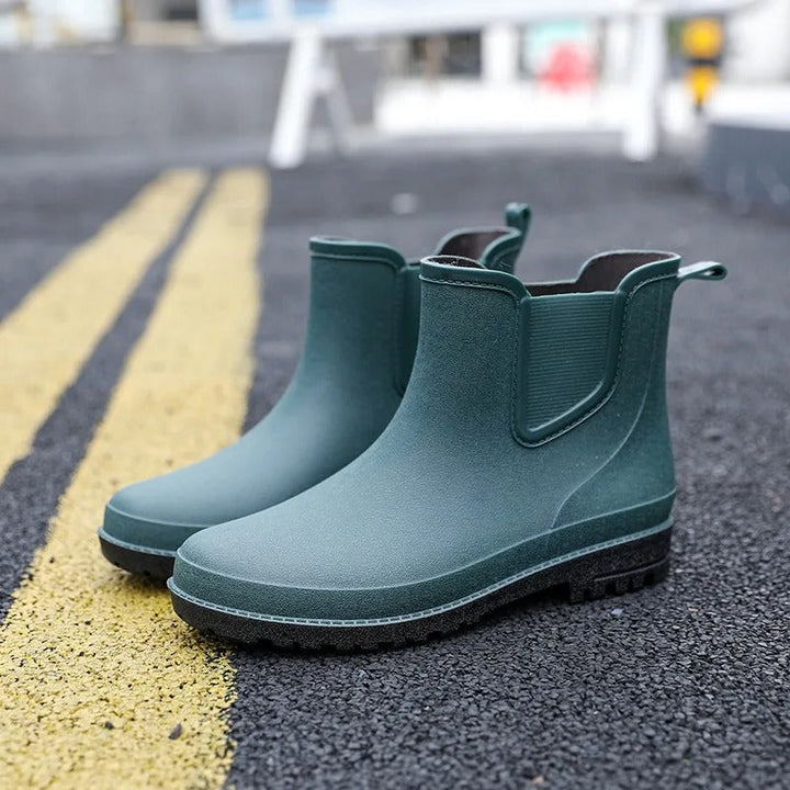 Durable women's waterproof Chelsea platform ankle boots. Slip-on rain boots for wet weather comfort.
