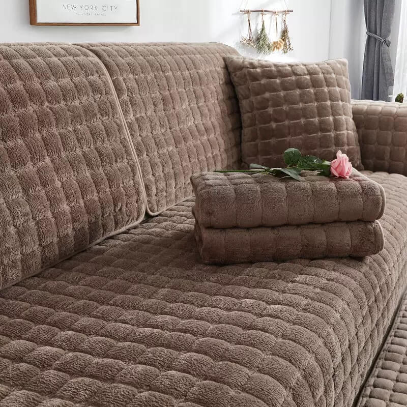 Close-up of quilted flannel couch cover texture, showing non-slip and scratch-resistant features
