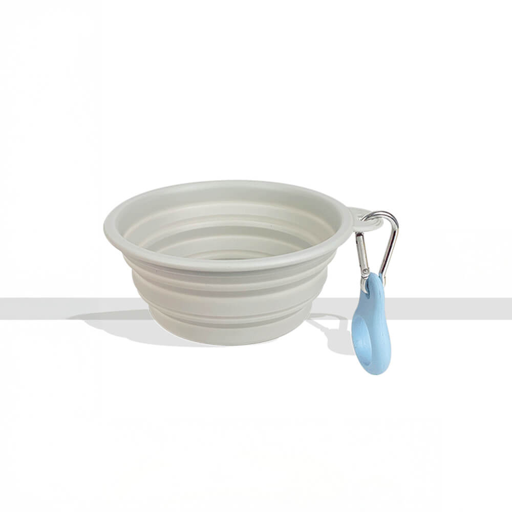 Compact pink silicone dog and cat travel bowl, ideal for food or water on the go.