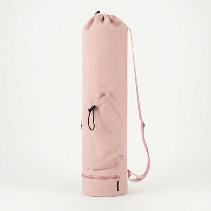 Pink women's cylindrical pilates mat carrier bag, essential workout gear for a hassle-free experience.