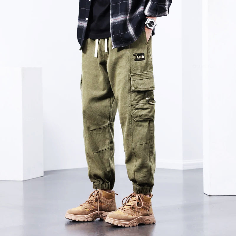 Black men's comfortable cargo pants with multi-pockets, ideal for stylish streetwear, workwear, or casual everyday outfits.