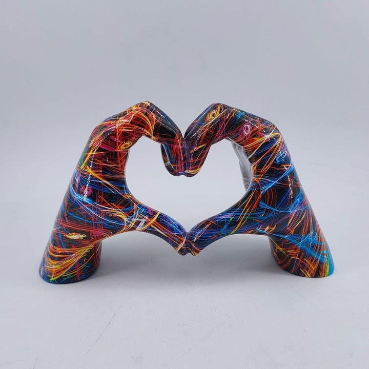 Decorative wooden Heart Hands figurine, handcrafted art bringing warmth to cozy home decor spaces.