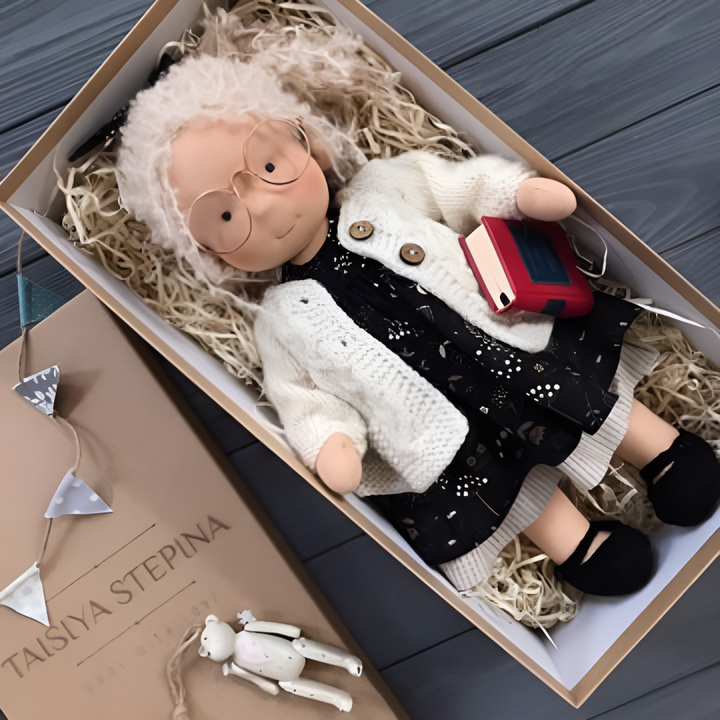 Handmade Waldorf cloth doll from organic cotton, ideal for imaginative children's play.