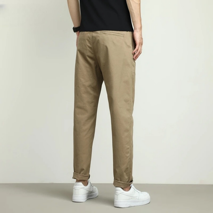Khaki men's performance tech travel pants. Stretch, water-resistant & wrinkle-free for comfort and style.