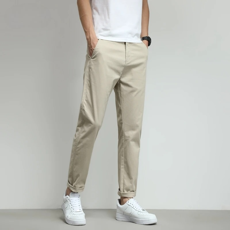 Beige men's casual slim-fit tech trousers. Comfortable and stylish for work, travel, or everyday wear.