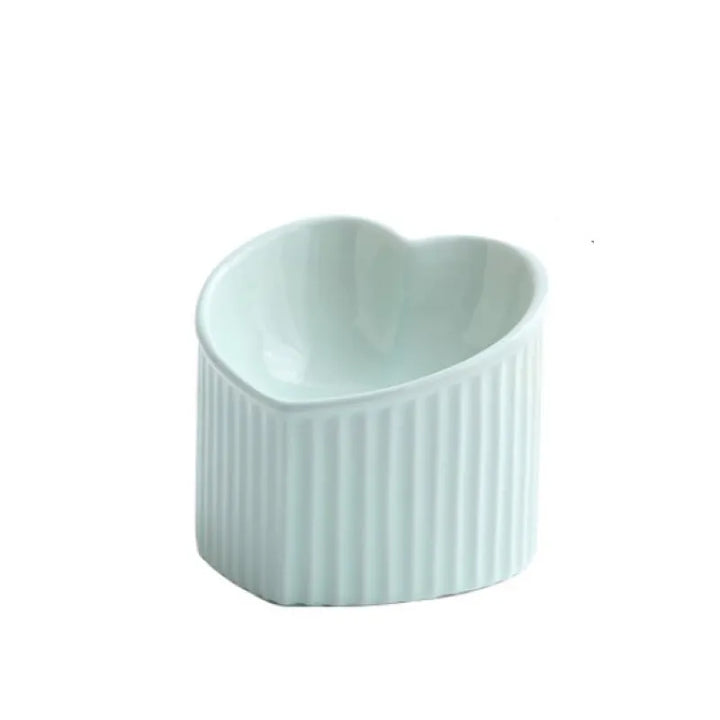 Empty heart-shaped ceramic pet food dish, clean and ready for kibble or wet food, pet care.