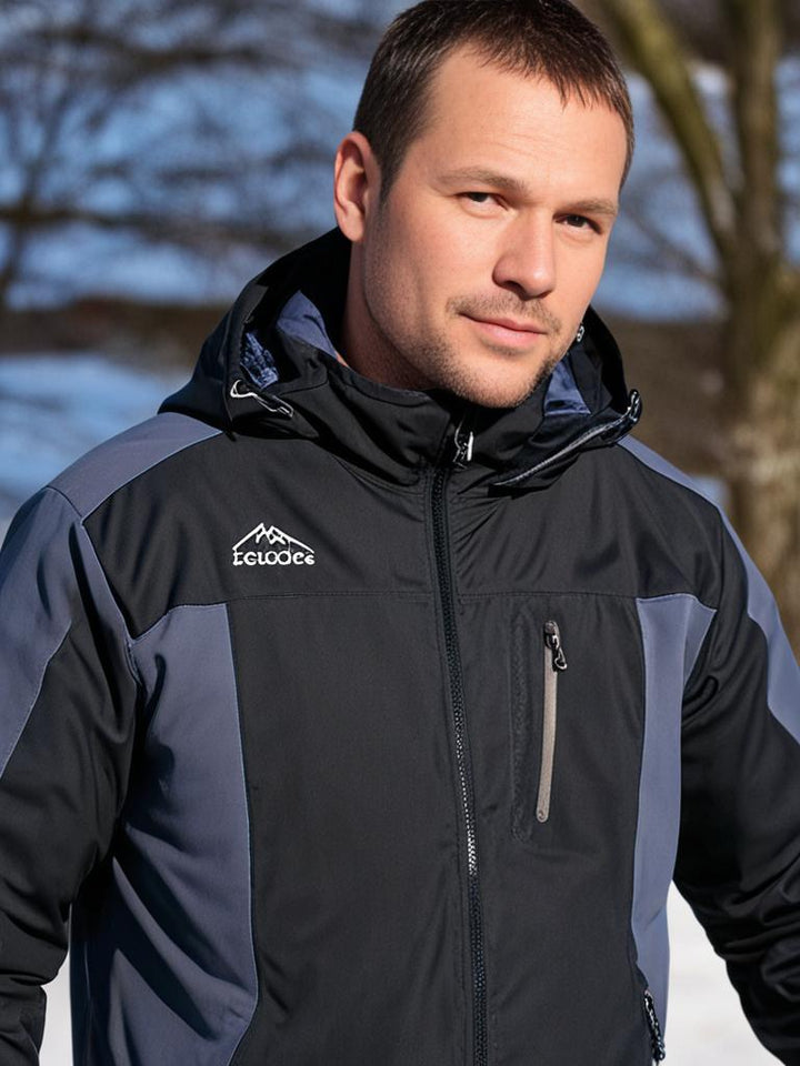 Herren-Outdoorjacke mit Kapuze, wasserdicht und winddicht, stilvolles Color-Block-Design, ideal für Herbst und Winter.