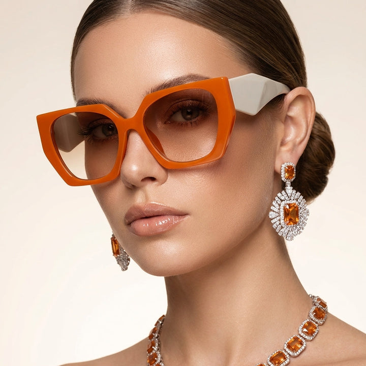 Women's oversized cat eye sunglasses with UV400 protection, stylish fashion eyewear accessory.