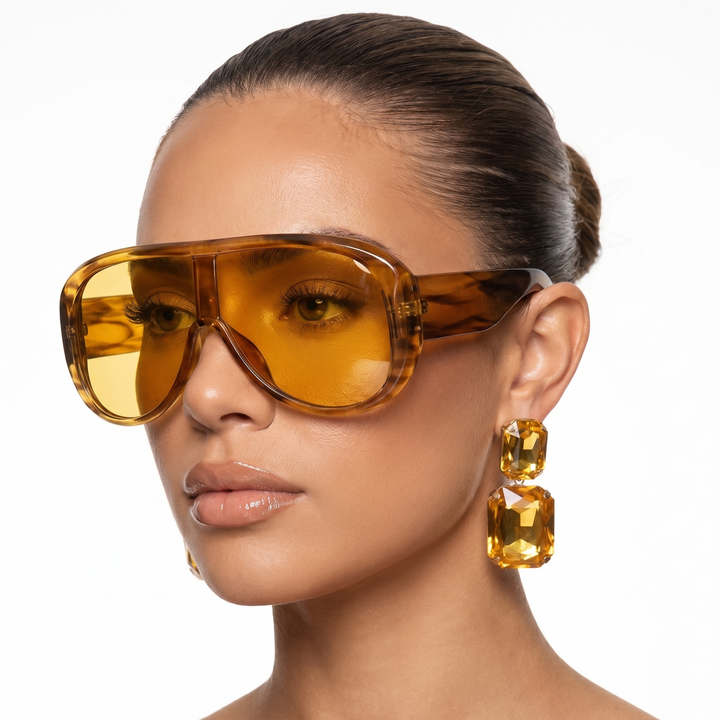 Stylish women's pilot sunglasses, lightweight with UV400 eye protection, perfect for travel.