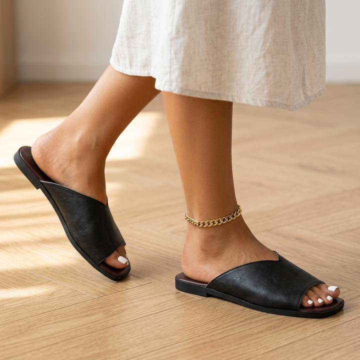 Comfortable slip-on open-toe flats for women, ideal for casual everyday summer wear.