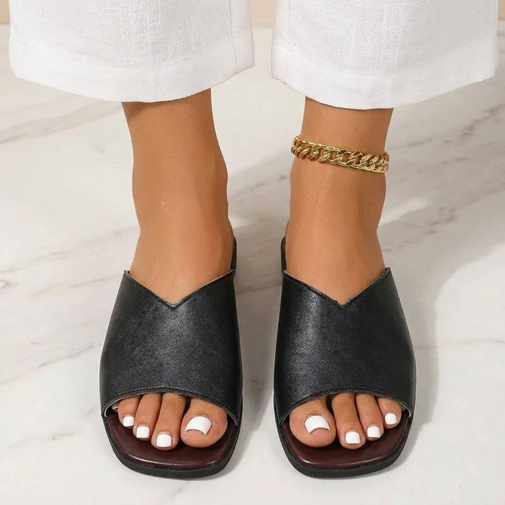 Stylish lightweight open-toe flats, a must-have for warm weather and spring fashion.