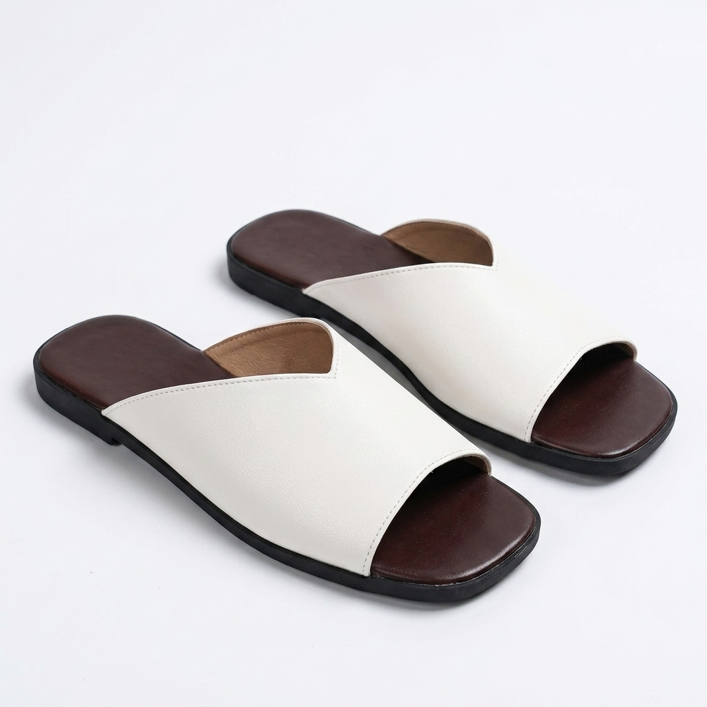 Essential open-toe flats for women, offering an easy-wear, stylish solution for warm weather.