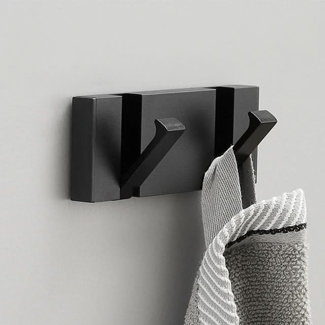 Open folding wall hook, ready for coats, bags. Modern aluminum design for efficient home organization.