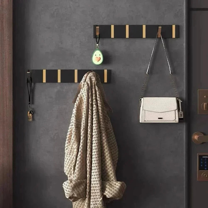 Collapsible wall hook for entryway coats, hats, & bags. Space-saving modern aluminum design.