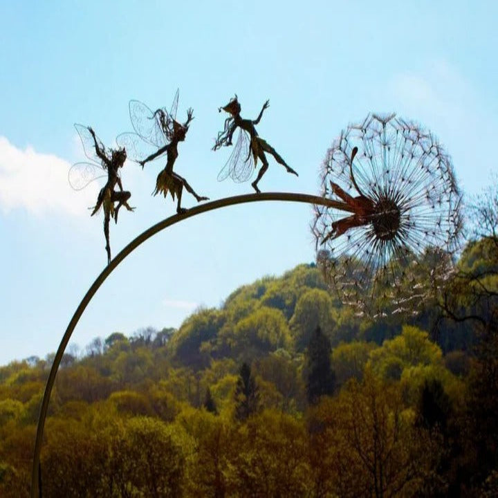 Detailed metal fairy and dandelion garden decor, whimsical outdoor stake art for yard.