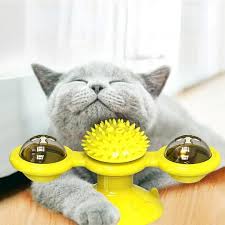 Interactive cat carousel spinner toy with colorful balls, perfect for feline fun and enrichment.