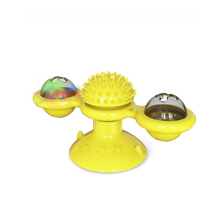 A happy cat batting at an interactive carousel spinner toy, stimulating natural hunting instincts.