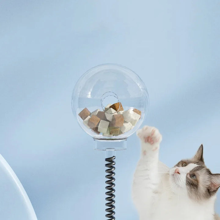 Side view of interactive cat treat dispenser toy featuring a flexible pole and wobbling action