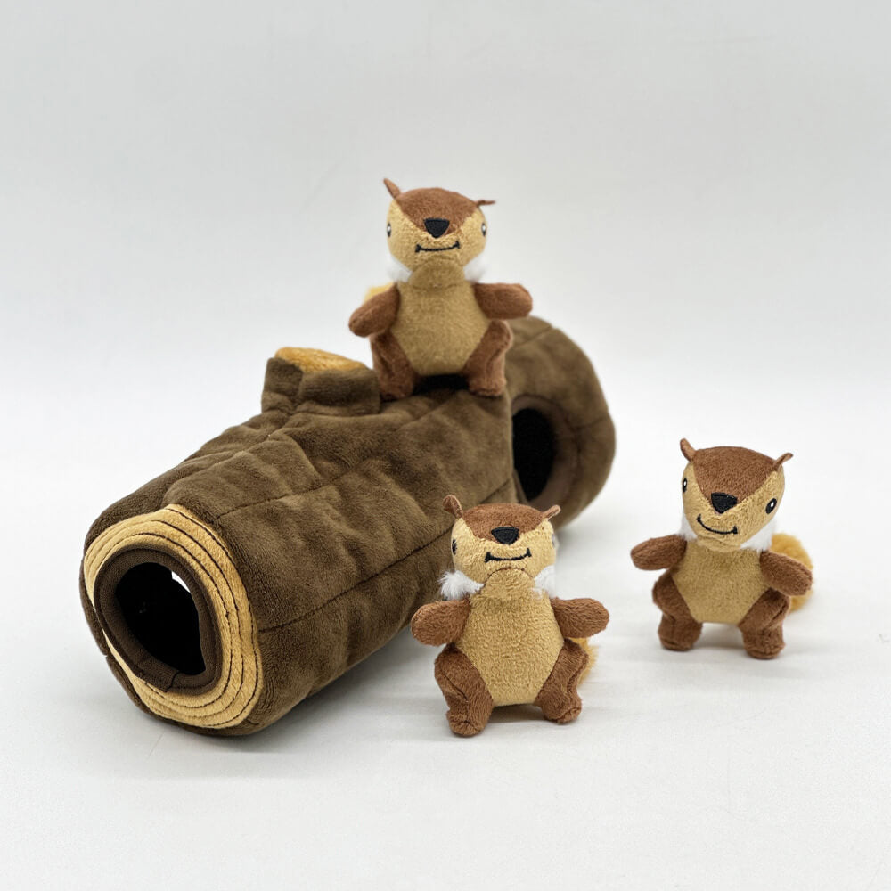 Plush interactive dog toy, a brown tree trunk with three squeaky squirrels partially visible