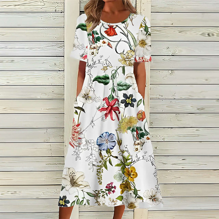 Elegantes weißes Kleid mit floralen Mustern für Damen