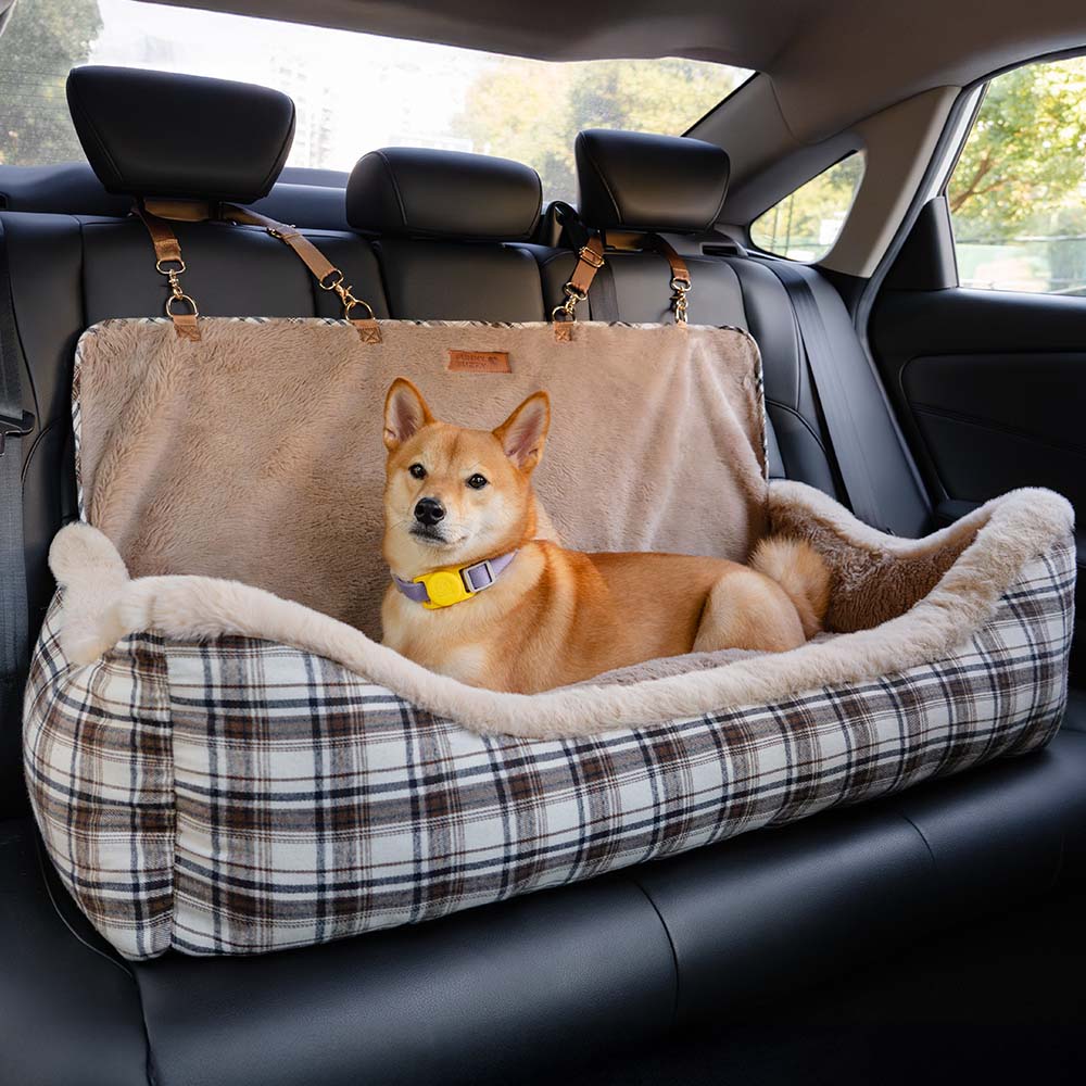 Khaki dog booster car seat with plush interior, providing secure and comfortable pet travel.