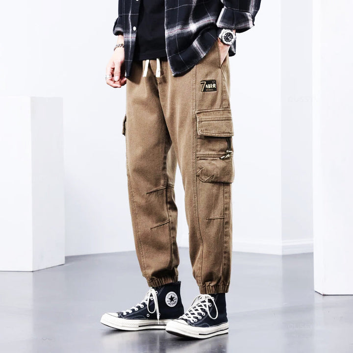 Green men's versatile cargo pants, ideal for casual wear, streetwear, or utility. Comfortable, stylish, and multi-pocket.