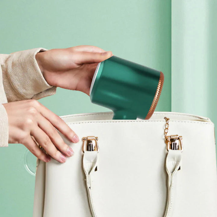 "Kompakter USB Fusselentferner, tragbar, ideal für Kleidung, entfernt Fusseln und Haare effizient, schonend für Stoffe."