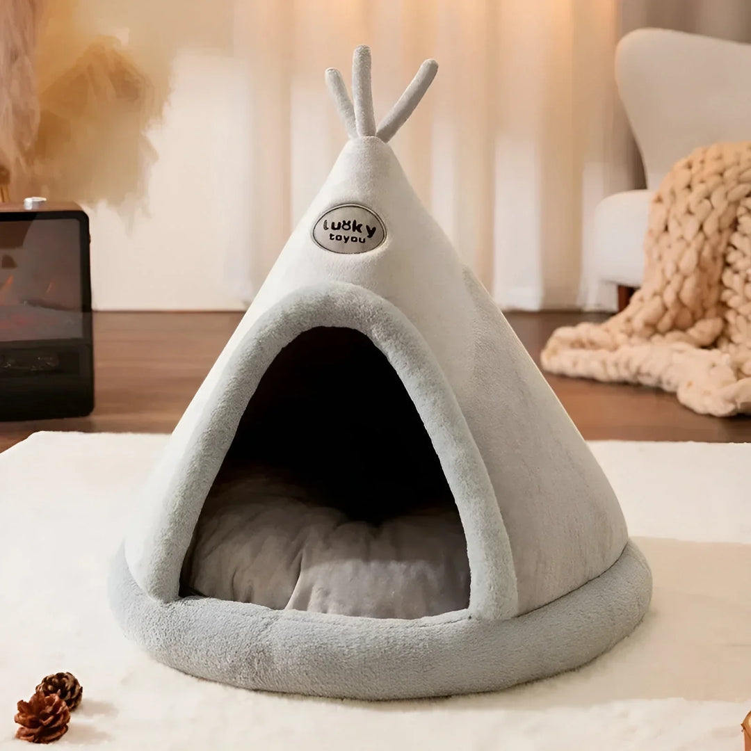 "Kuschelhöhle für Haustiere im Tipi-Design, weiche Polsterung, wärmespeichernd, gemütlicher Rückzugsort für Hunde und Katzen.
