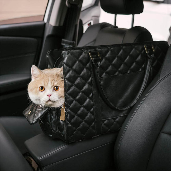 Portable pet travel bag with an adjustable shoulder strap, grey, for hands-free carrying