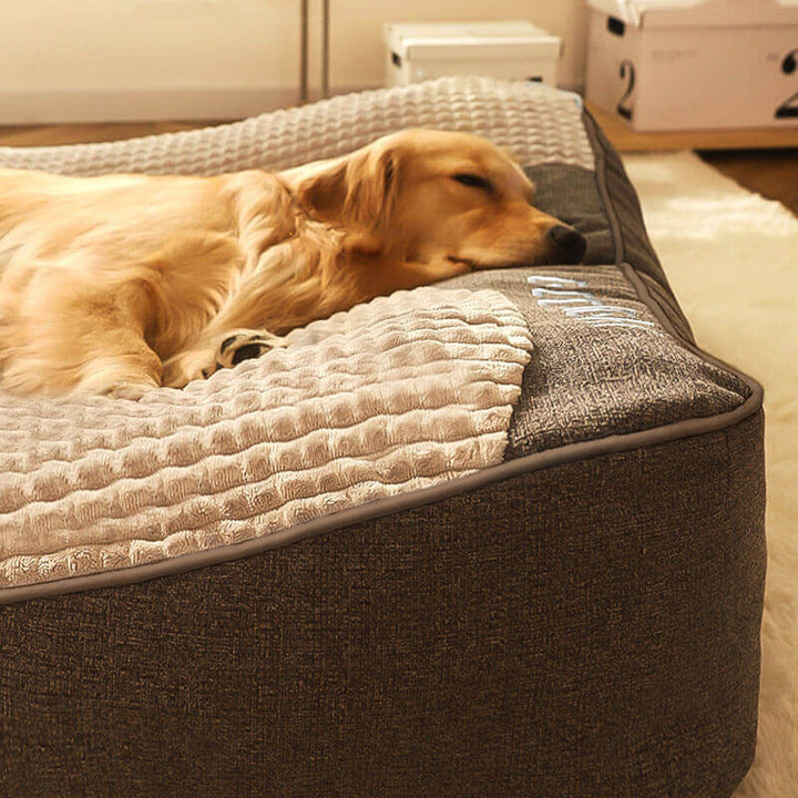 Brown large orthopedic dog bed with a durable, scratch-resistant cover for pet comfort.