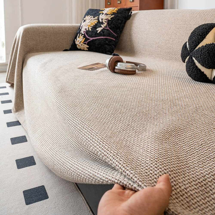 Linen-look scratch-resistant sofa cover in a neutral hue, perfect for pet-friendly home decor