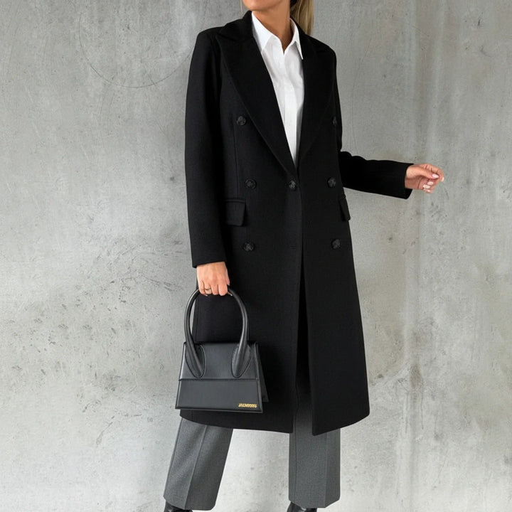 Women's elegant double-breasted long winter coat with notch lapel, perfect for chic warmth & classic fall fashion.