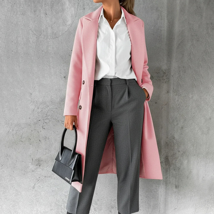 Elegant women's long double-breasted coat for winter, providing classic warmth and sophisticated fall outerwear.