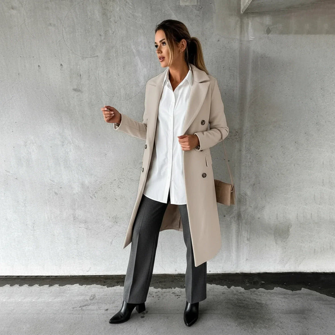 Classic women's double-breasted long winter coat, warm and elegant, suitable for various fall fashion looks.