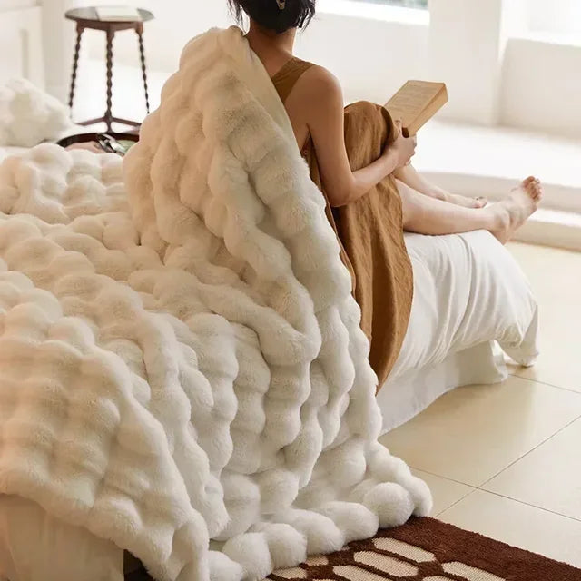 Unisex super soft faux fur throw for ultimate cozy comfort on sofa or bed.