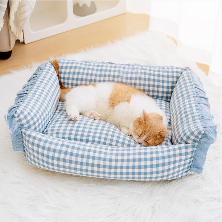 Luxurious plaid pet bed with ruffles, soft and cozy for dogs and cats