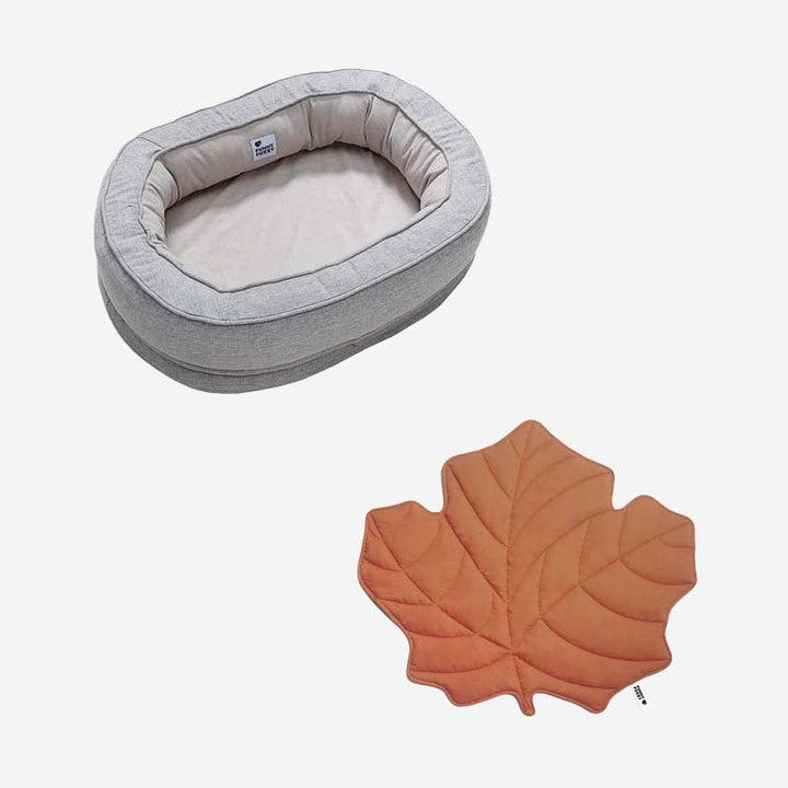 Dog sleep improved with this luxury leaf blanket & donut bed.