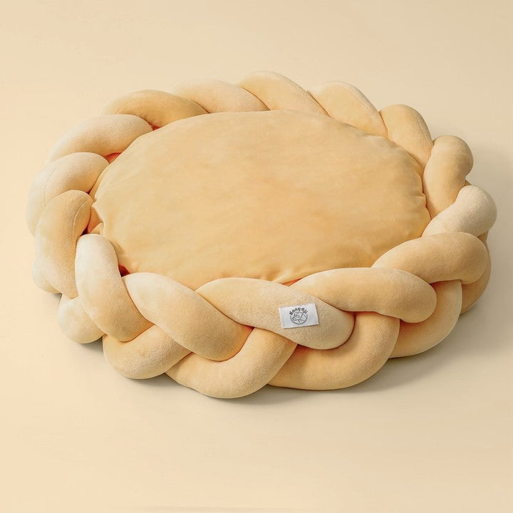 A dog deeply asleep in a plush, luxurious calming pet bed, highlighting its comfort features.
