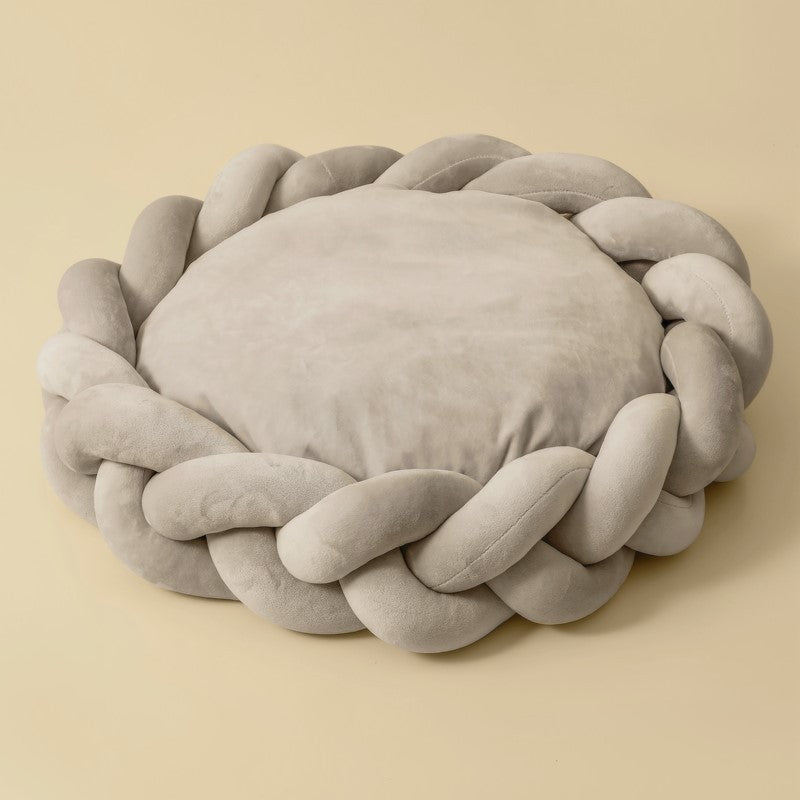 Washable dog bed in a modern living room setting, blending with home decor, pet comfort.