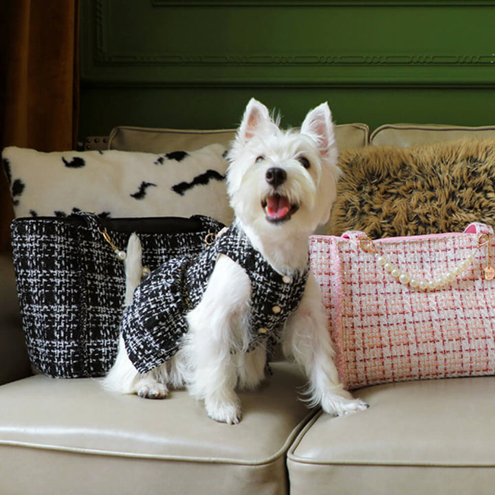 Hand-held tweed checkered pet carrier bag, designed for easy and stylish pet travel.