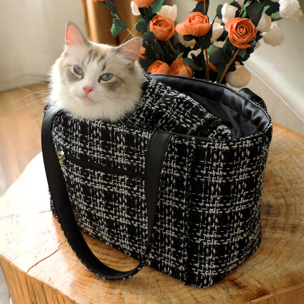 High-end small pet carrier, tweed material, comfortable padding & ventilation for travel.
