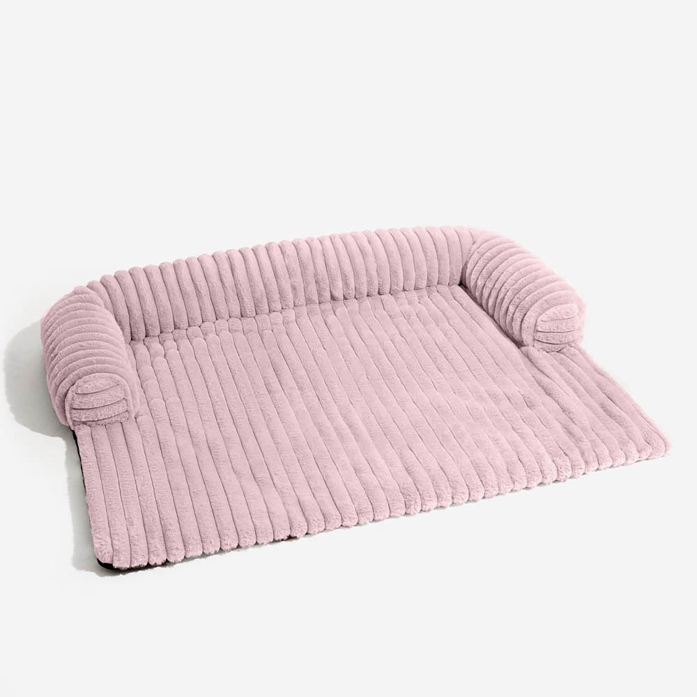 Stylish pet accessory: quilted sofa cover acts as a cozy pet bed and furniture protector