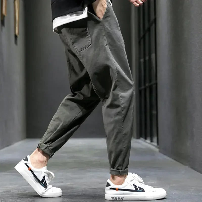 Comfortable men's tapered casual pants, featuring a drawstring for ultimate comfort and everyday style.