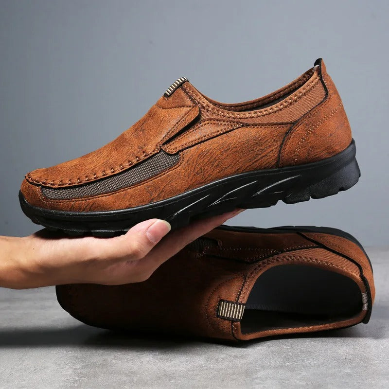 Black men's slip-on comfort loafers for everyday wear. Cushioned casual footwear, easy to slip on.