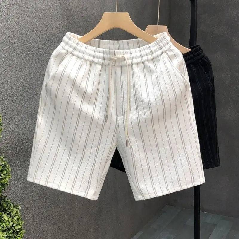 Comfortable men's ivory pinstripe tailored shorts. Features elastic waist & drawstring, ideal for casual summer style.