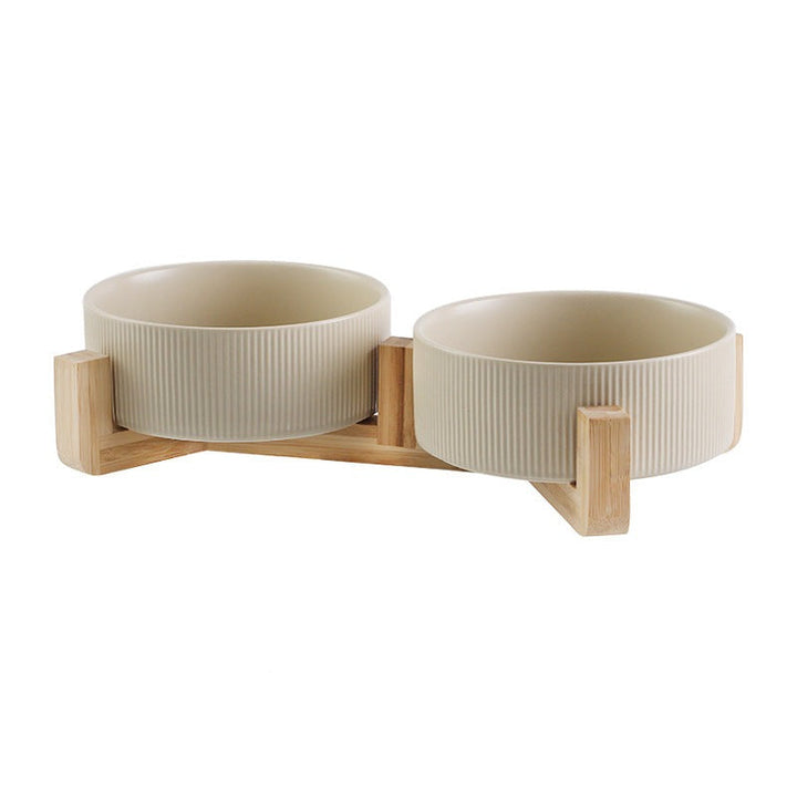 Stylish pet accessories: matt black ceramic dog and cat bowls in a robust wooden holder.