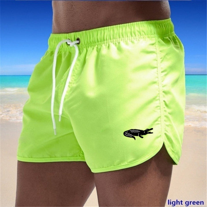 "Mehrfarbige, leichte Strand-Shorts mit elastischem Bund und modernem Druck, perfekt für Sommer und Sport."