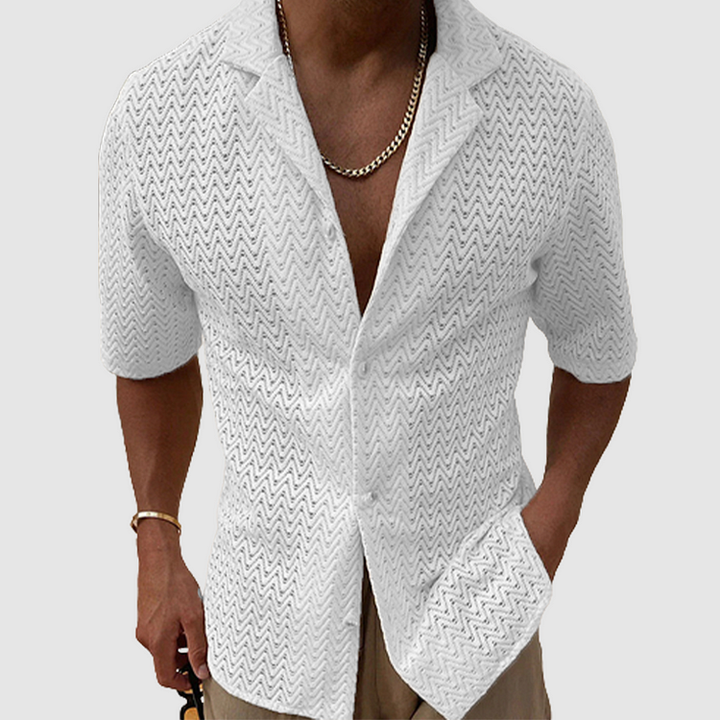 Man wearing a relaxed fit, breathable open-weave leisure shirt, enjoying a comfortable summer day. Perfect casual style.