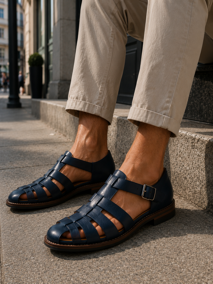 Men's brown leather fisherman sandals with closed toe and buckle strap, ideal for summer comfort & secure all-day wear.
